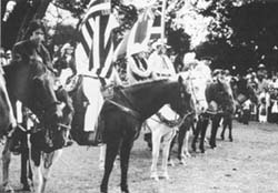 1983 Grand Finale with sonny Miranda(foreground), Anna on white horse with the late Richard Lindsey holding the Hawaiian flag.